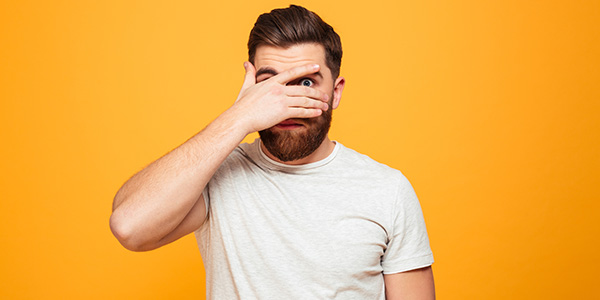 Bearded man on orange background